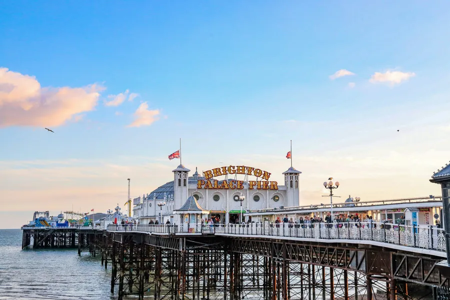 Brighton Palace Pier stretching out to sea on a sunny evening